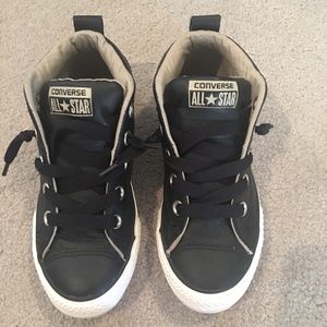 Black high top Converse sneakers